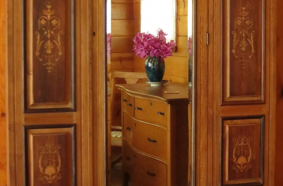 Waipio Wayside, Birds Eye Room, wood dresser flanked by ornate wooden panels